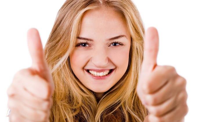 woman giving thumbs up trivia science quiz