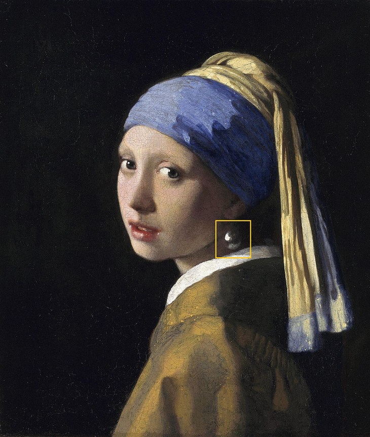 curious detail in famous art Johannes Vermeer, Girl with a Pearl Earring (c. 1665)