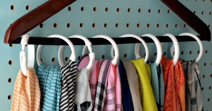 Organization Hacks to Declutter Your Closet shower curtain rings on a hanger