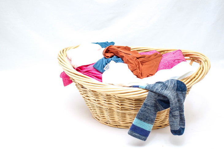 Organization Hacks to Declutter Your Closet basket with clothes