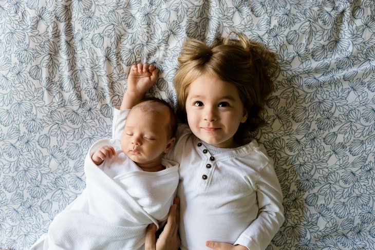 Facts About Mental Illness Everyone Should Know girl and baby on the bed together siblings