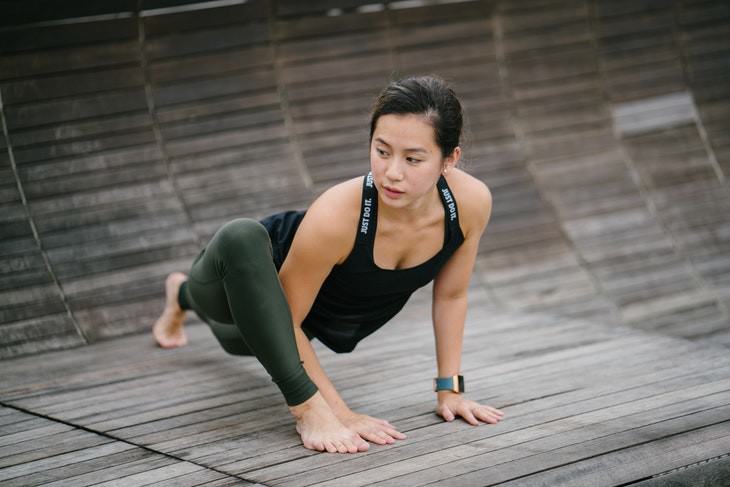 sweating out a fever woman doing yoga