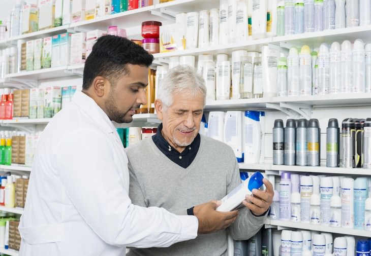 sulfates pharmacist helping man select a shampoo