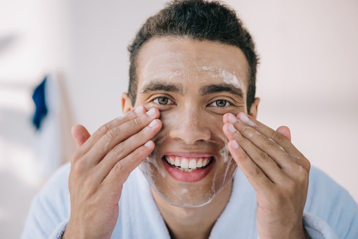 sulfates man washing his face
