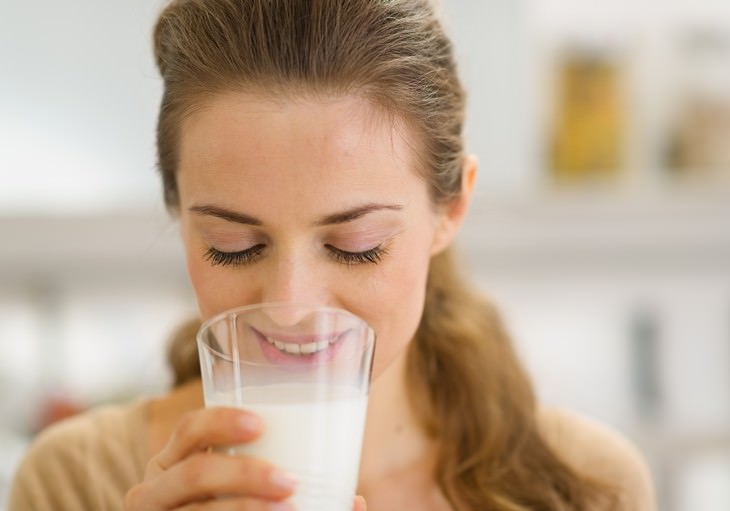 Myths about the Cold and Flu woman drinking a glass of milk