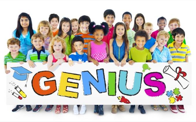 sign held by kids with genius on it