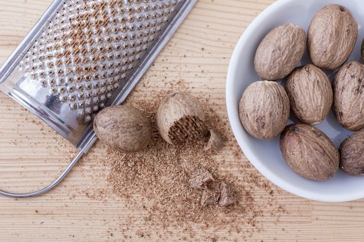 healthy foods that can be toxic nutmeg being grated using a grater