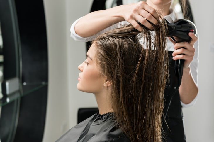 bad habits for skin and hair at the salon blow drying hair
