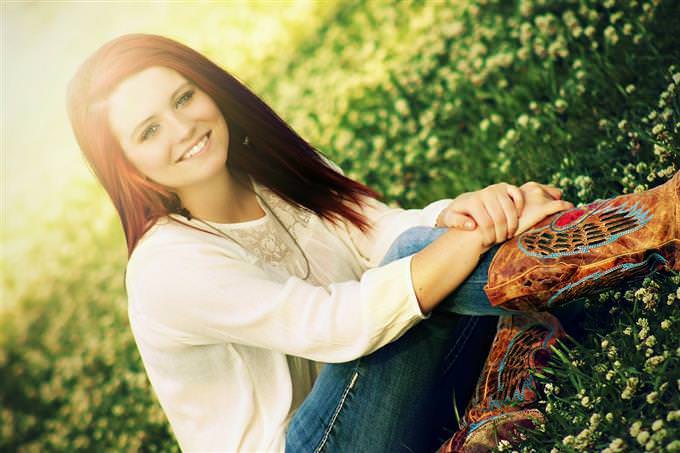 woman sitting on grass smiling