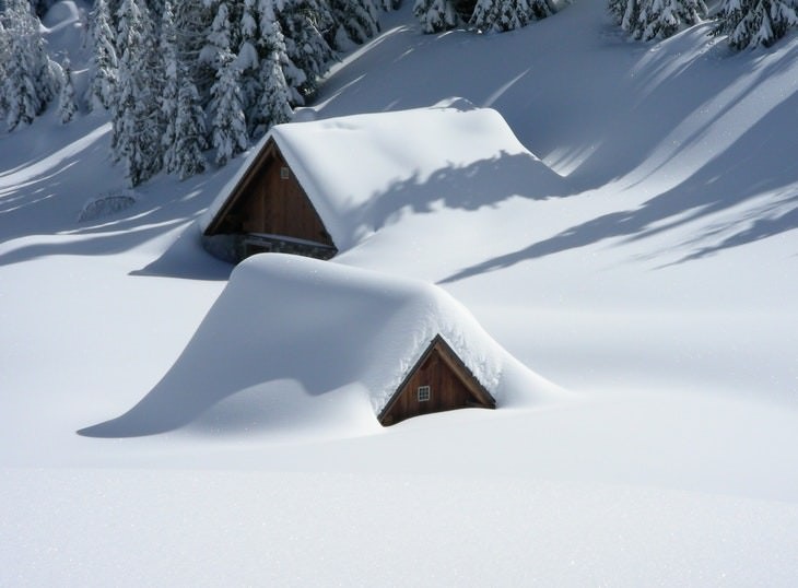 winter landscapes collection Wooden Cabins Fully Laden With Snow