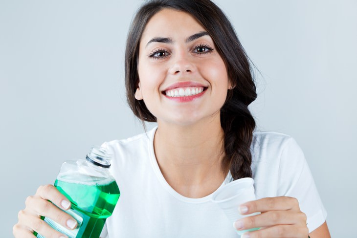 mouthwash dangers woman smiling after using mouthwash