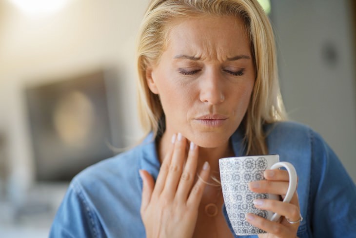 rose water woman in pain with cup touching throat with hand