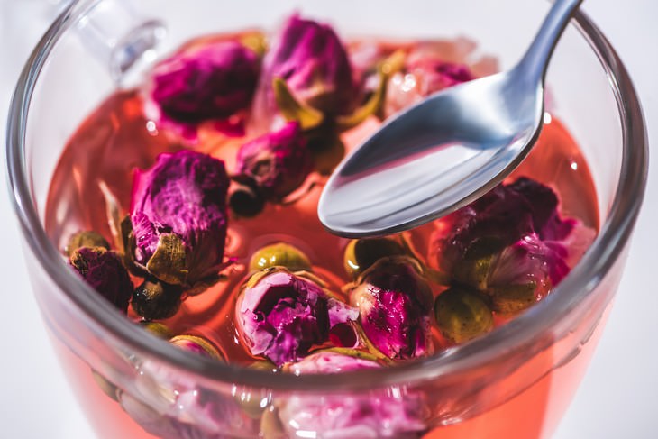 rose water rose tea with rose buds and spoon close shot