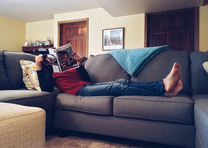 Furniture Cleaning Mistakes man sitting on the sofa