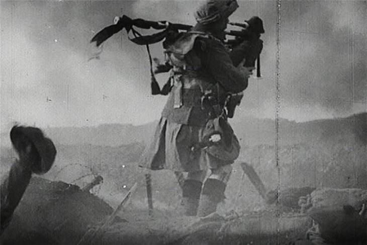 historical photosA bagpipe player comes out of hiding first and leads the soldiers into battle - 1910.
