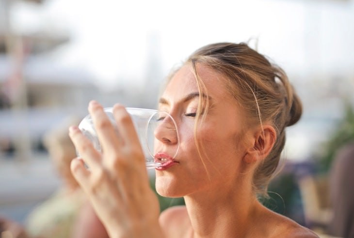 stress constipation woman drinking water