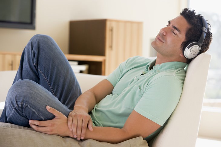 language learning man taking a nap in headphones