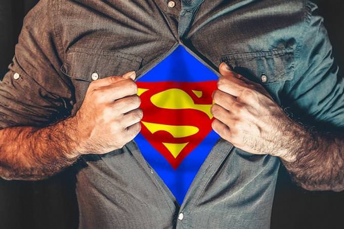 quiz man opens shift to show superman symbol