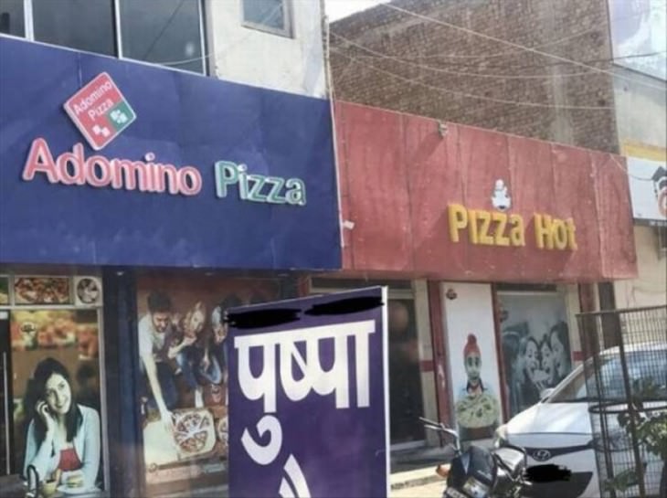 funny street signs adomino and pizza hot