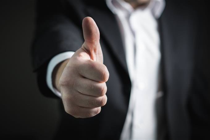 improve your life quiz: man in suit giving a thumbs up