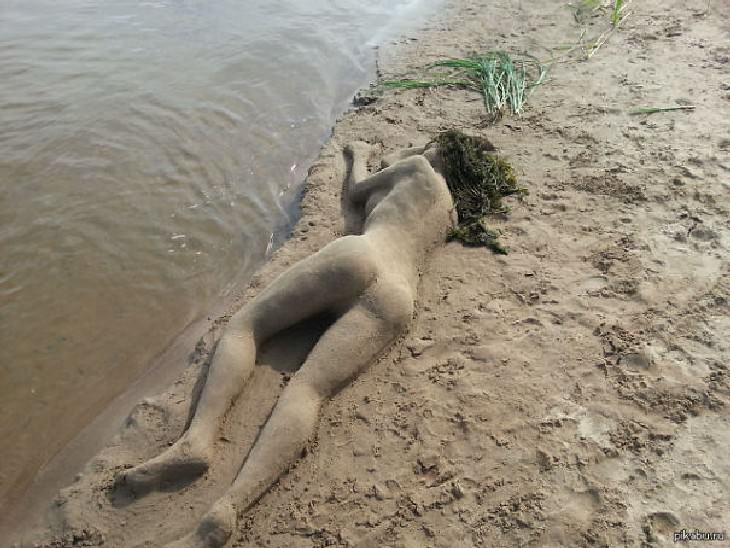 hilarious beach photos mermaid sand sculpture