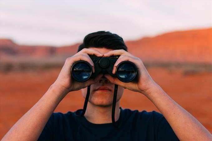 man in binoculars