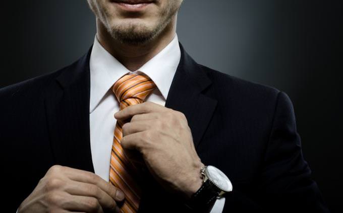 Quote quiz: man tightening tie