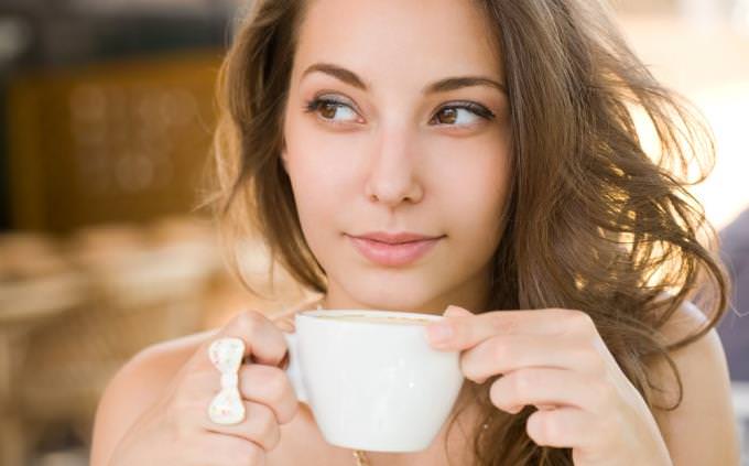 solar system quiz: woman drinking coffee
