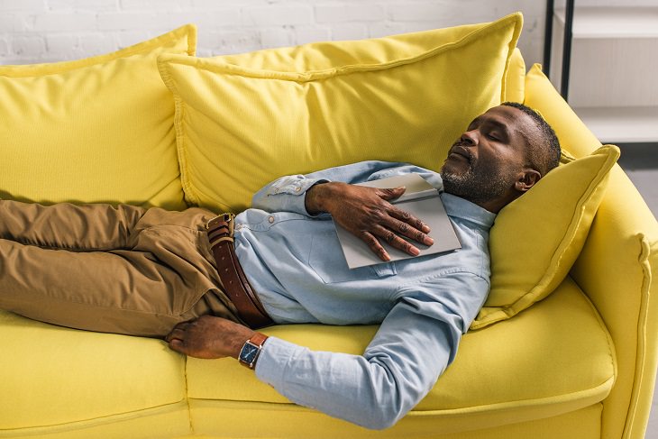 Alzheimer's and sleep man taking a nap on couch