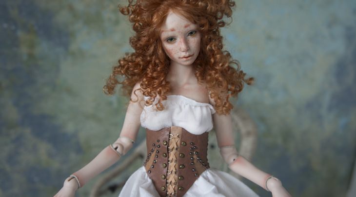 Porcelain dolls: curly redhead leather corset