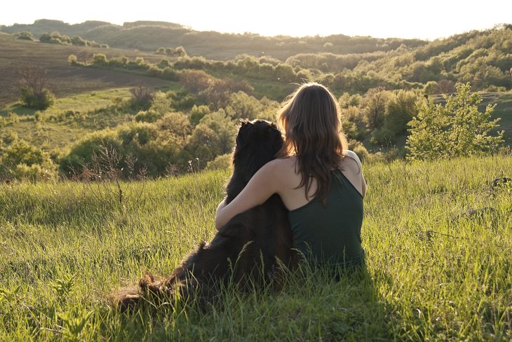 Emotional support dog: hugging dog outside