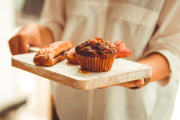 dealing with guilt woman holding a cutting board with desserts