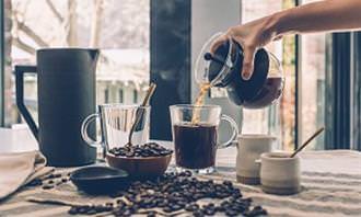 table with coffee beans, and coffee paraphernalia