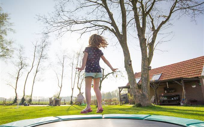 Boy jumping on trampoline