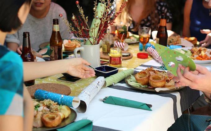 people sitting and eating around a table