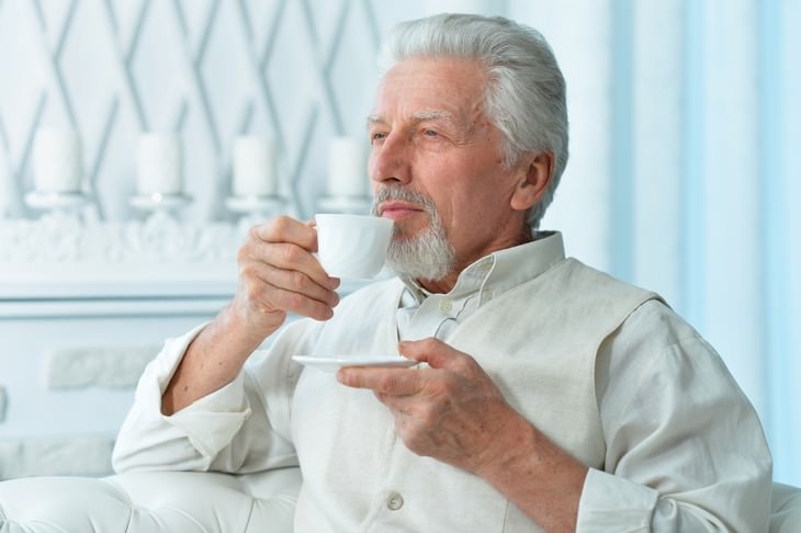 dehydration in seniors senior man drinking coffee