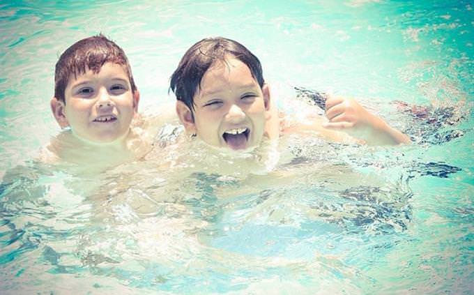 2 boys in a swimming pool