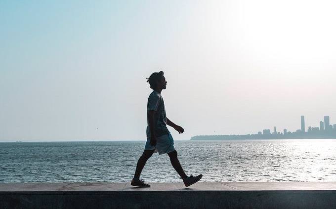 man walking on the beach