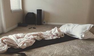 pillow and blanket on floor