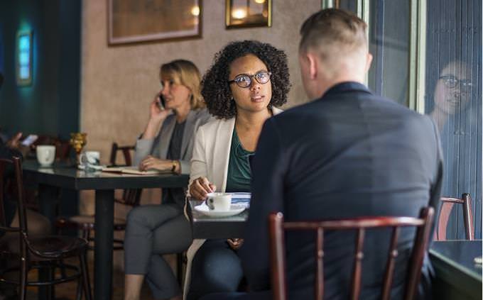 people sitting and talking in a cafe