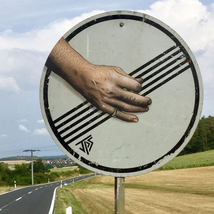 Clever and Captivating Street Art by JPS, road sign