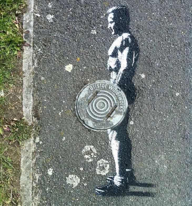 Clever and Captivating Street Art by JPS, weightlifter