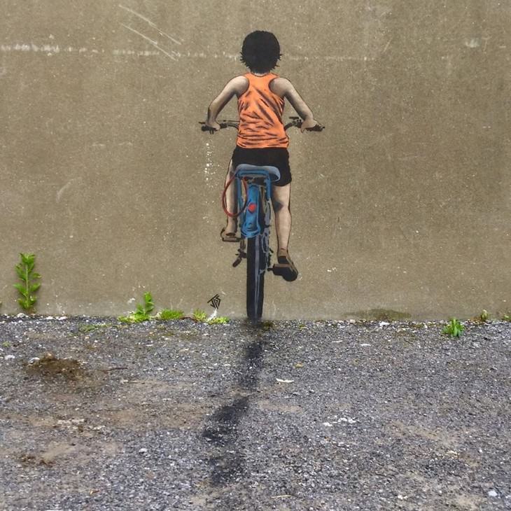 Clever and Captivating Street Art by JPS, kid riding bike