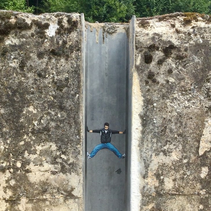 Clever and Captivating Street Art by JPS, climbing man
