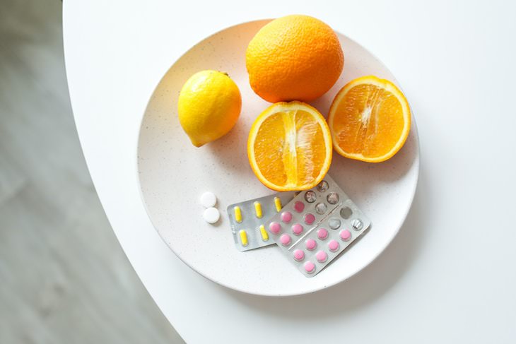 myths about vitamins and supplements oranges and pills on a plate