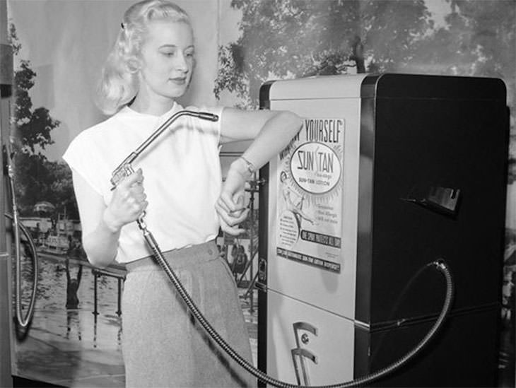 Past Beauty Practices That Seem Strange Today, Woman using a sun tan venidng machine, 1949