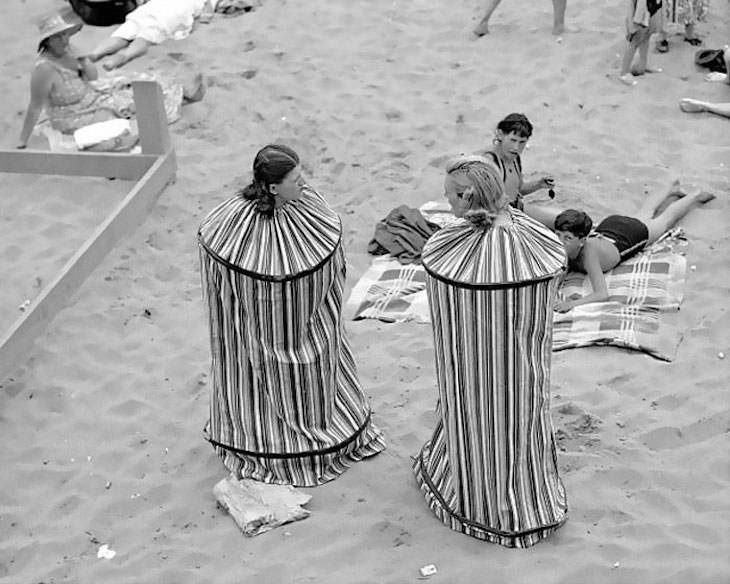 Past Beauty Practices That Seem Strange Today, portable bathhouse so they can change their clothes after sunbathing on Coney Island Beach, 1938