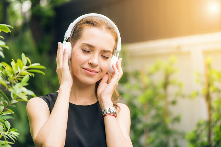 Natural Ways to Increase Dopamine Levels woman listening to music