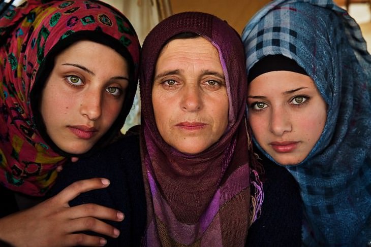 The Beauty of Motherhood in 18 Different Cultures Mother and her two daughters who fled Syria, Idomeni Refugee Camp, Greece