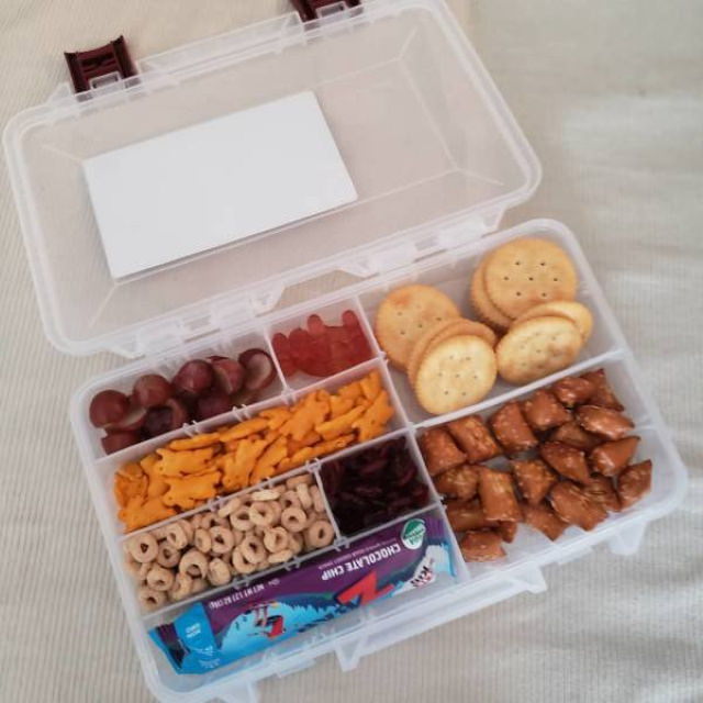 Parenting Hacks box with dividers and some snacks 